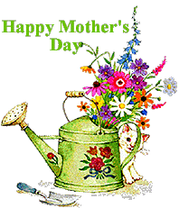 a watering can with flowers